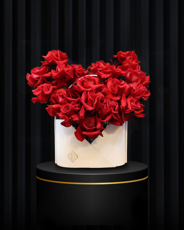 Scarlet Charm – White Leather Bag Flower Arrangement